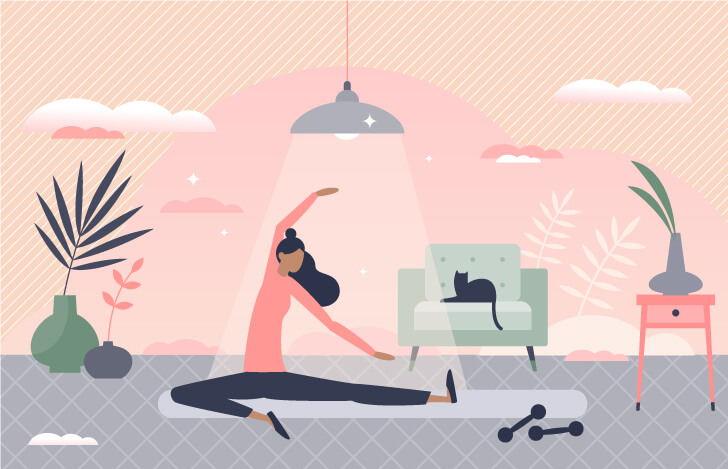 室内でヨガをする女性