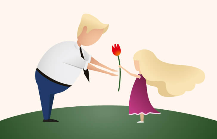 父親に花を渡す少女