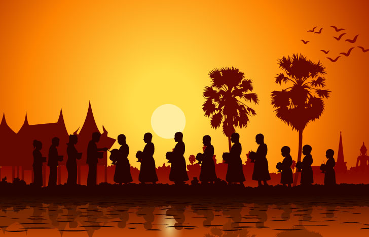 村の人々から施しを受ける仏教の僧侶の姿