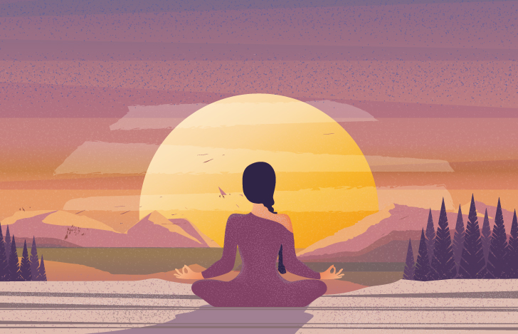 沈む夕日に向かって座る女性の背中