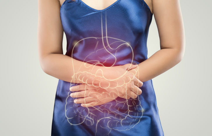 お腹を抱える女性と消化器のイラストのダブルイメージ