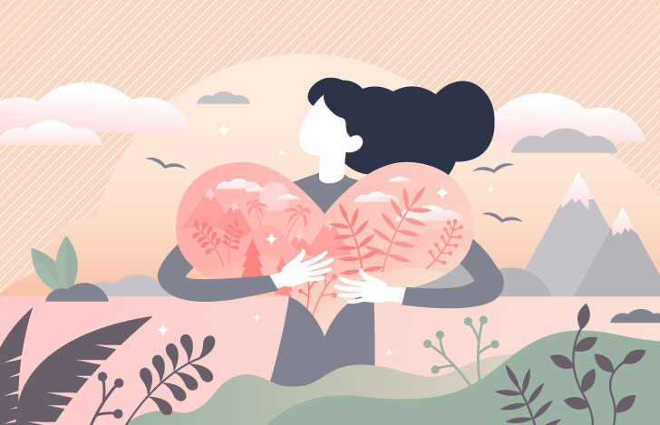 大きなハートを両手で抱きしめている女性