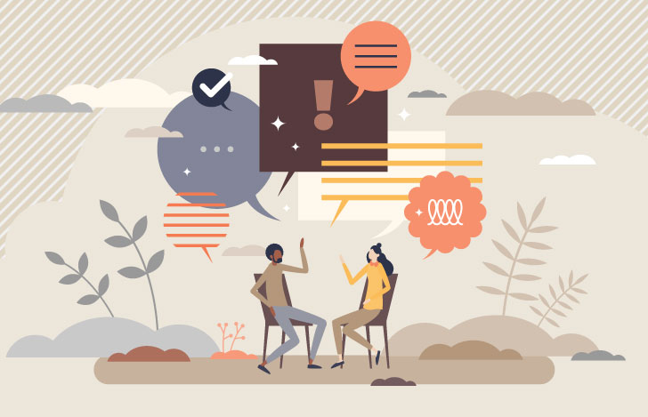 二人の男女が椅子に座ってコミュニケーションを図る様子のイラスト