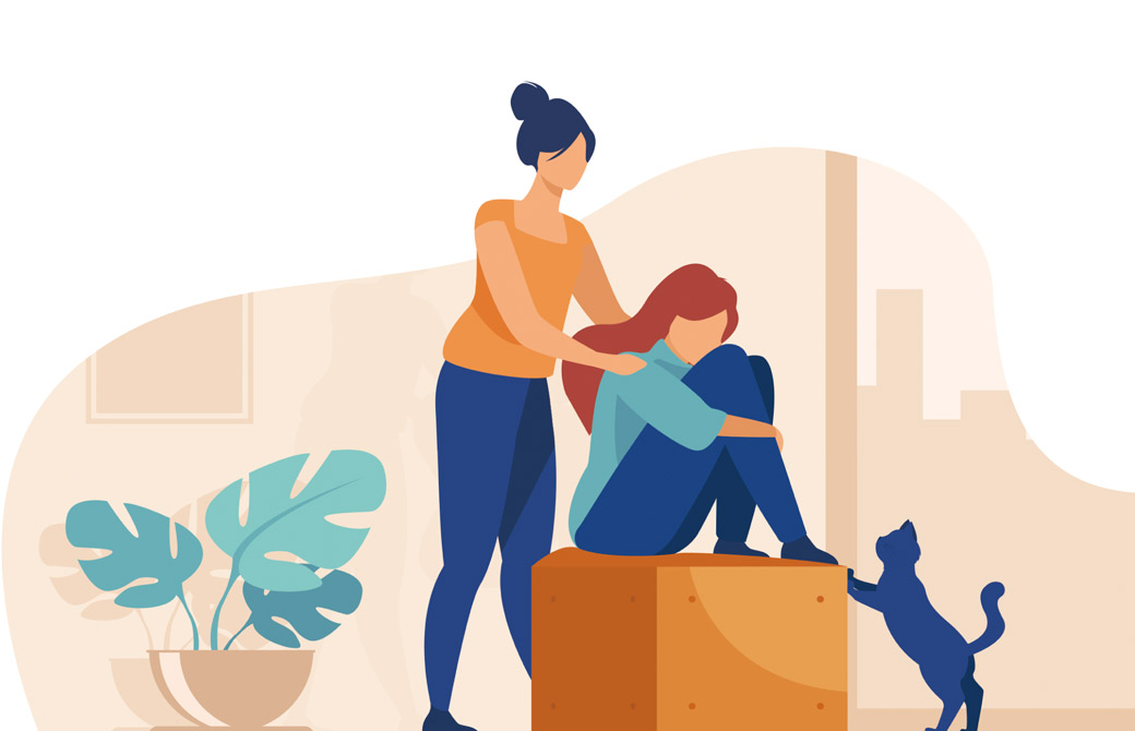 座っている女性に手を添える女性と猫