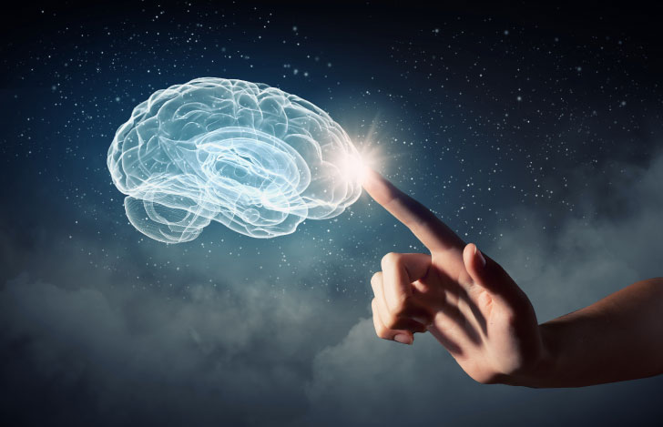 脳のイラストに触れようとする人の手